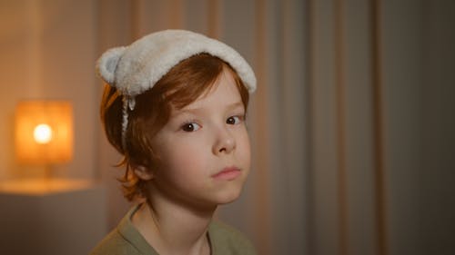 Free Photograph of a Child with a White Sleep Mask Stock Photo
