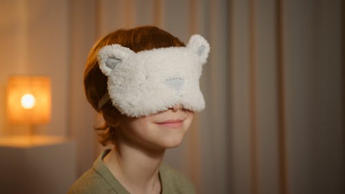 Free Photograph of a Boy with a Sleep Mask Stock Photo