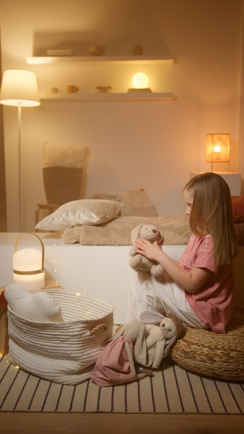 Free Girl In Pink Sleepwear Playing With Stuff Toys  Stock Photo