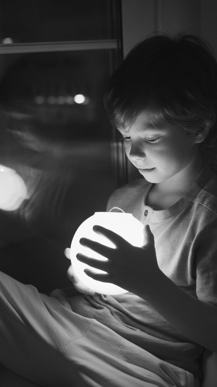 A Boy With A Glow Ball