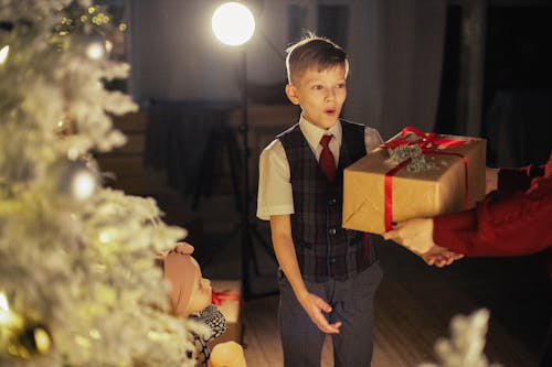 Boy Receiving A Surprise Gift