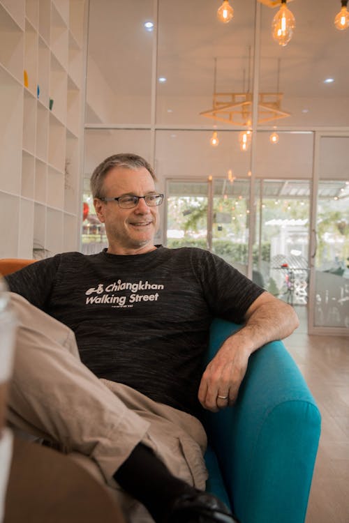 Man Sitting on Armchair