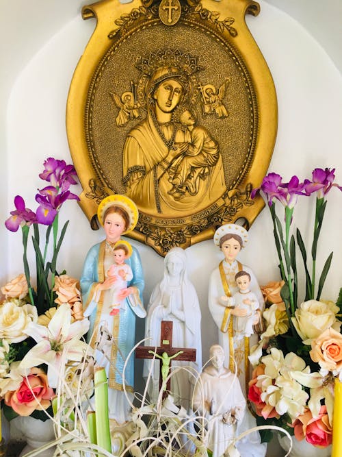 Free Figurines and Religious Art Portraying Jesus and Mother Mary Stock Photo