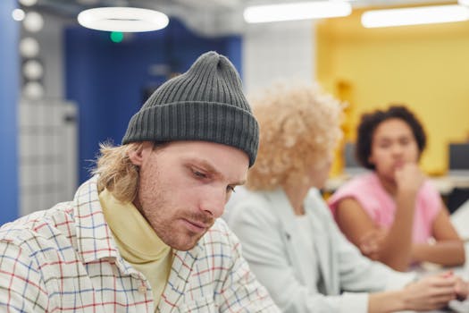 Diverse team of coworkers collaborating in a modern office environment.