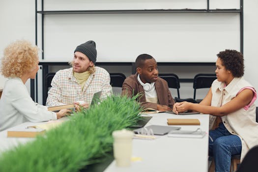 A diverse group of adults discussing a project in a modern office environment, fostering teamwork.