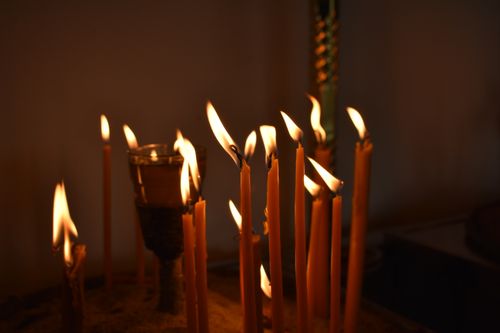 Free Warm glow of candles creates a serene atmosphere. Stock Photo