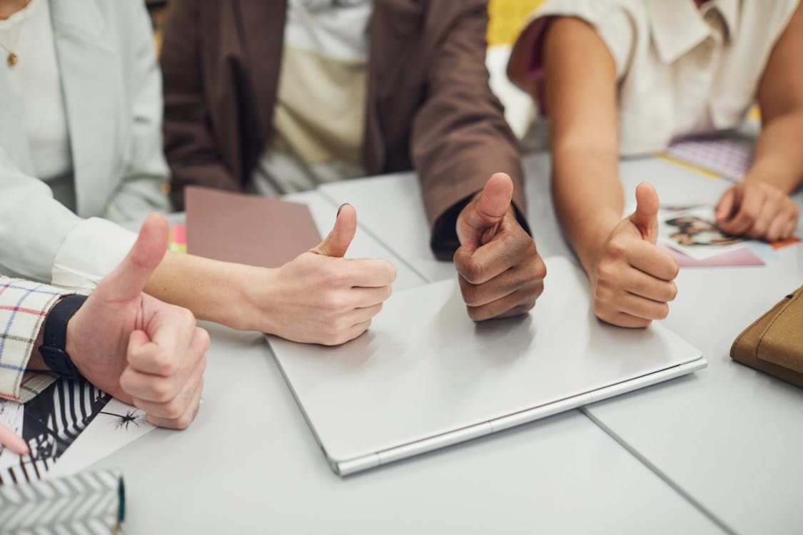 Free People's Hands Gesturing a Thumbs Up Stock Photo