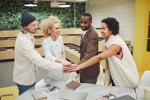 Coworkers Huddling in the Room