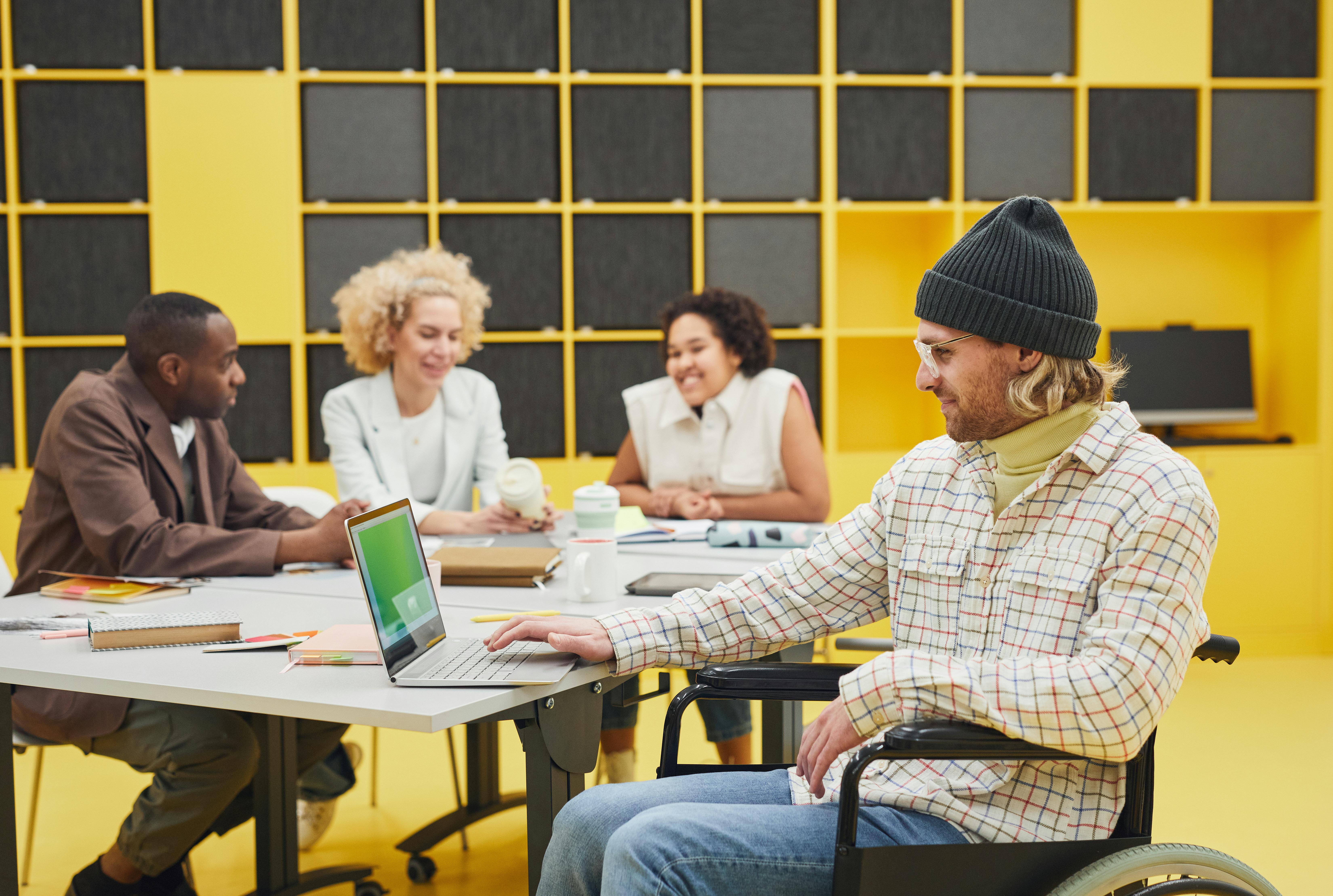 A diverse team of business professionals working together in a modern office, promoting inclusivity and teamwork.