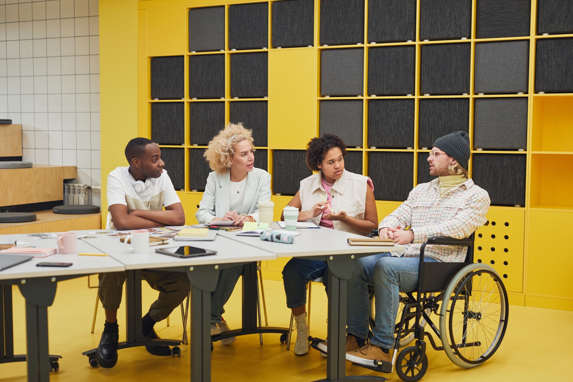 A diverse team having a collaborative meeting in a vibrant modern office setting.