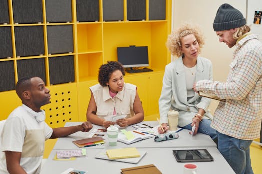 A diverse group of coworkers engaged in a creative brainstorming session in a modern office environment.