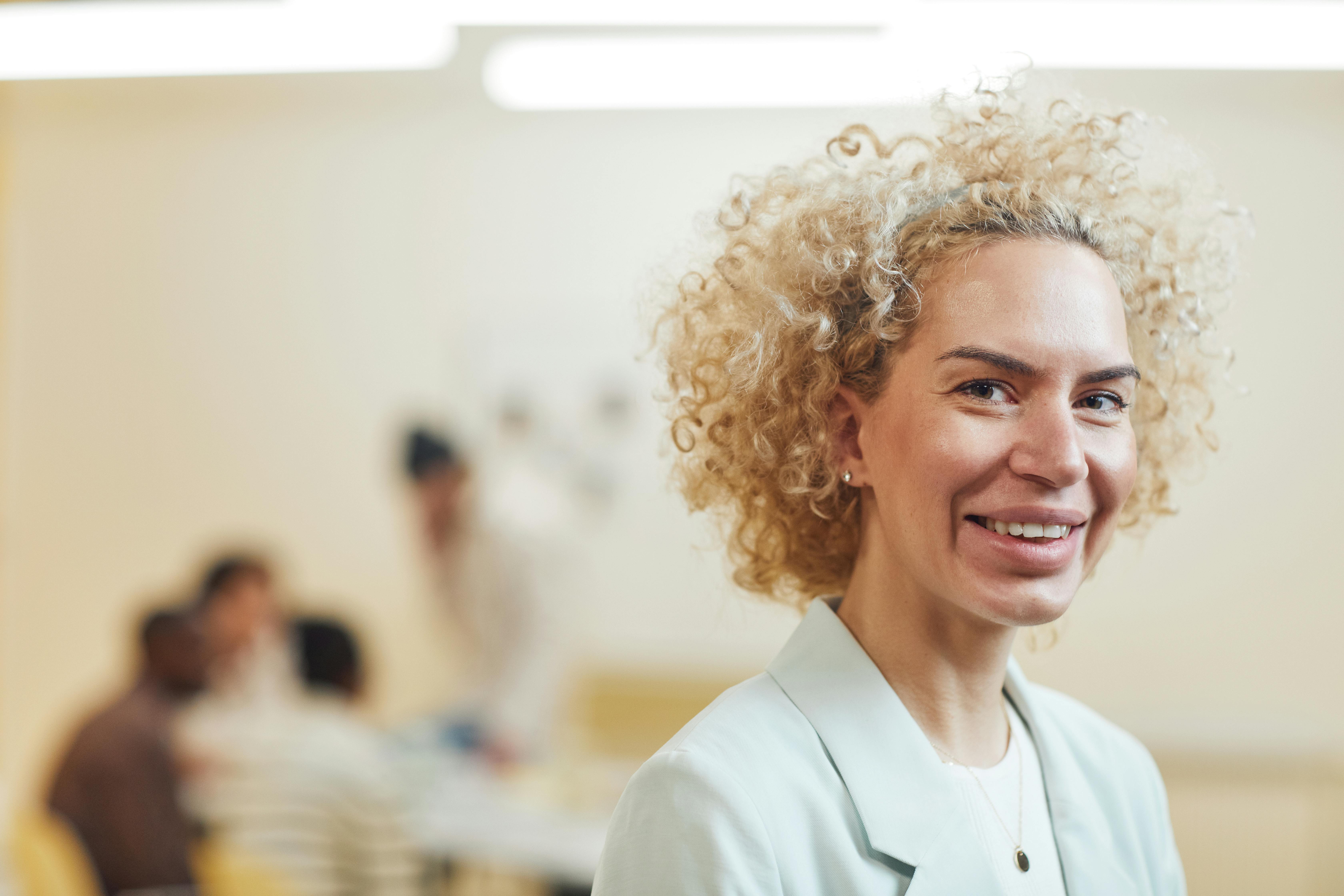 Close-Up Shot of a Curly-Haired Woman