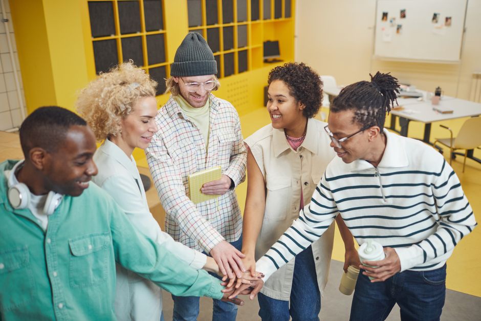 A diverse group of employees in a Maryland-based office setting - maryland new hire reporting A diverse group of employees in a Maryland-based office setting - maryland new hire reporting