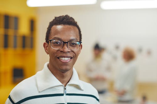 Close-Up Shot of a Man Wearing Eyeglasses