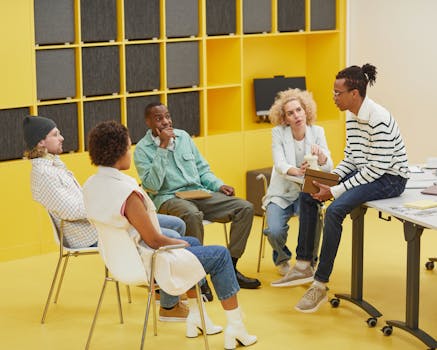A diverse group of coworkers engaged in a creative brainstorming session in a modern office.