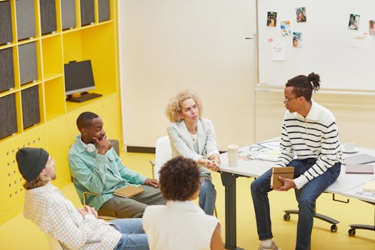 A diverse group engaged in a creative brainstorming session in a modern office setting.