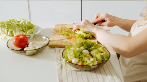 A Person Cutting Vegetables