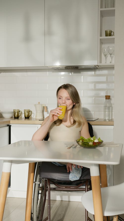 Free A Woman Drinking a Fruit Juice Stock Photo