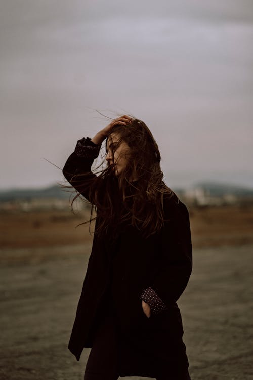 A Woman Wearing a Black Long Sleeve Shirt