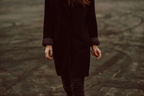A Person Wearing a Black Coat