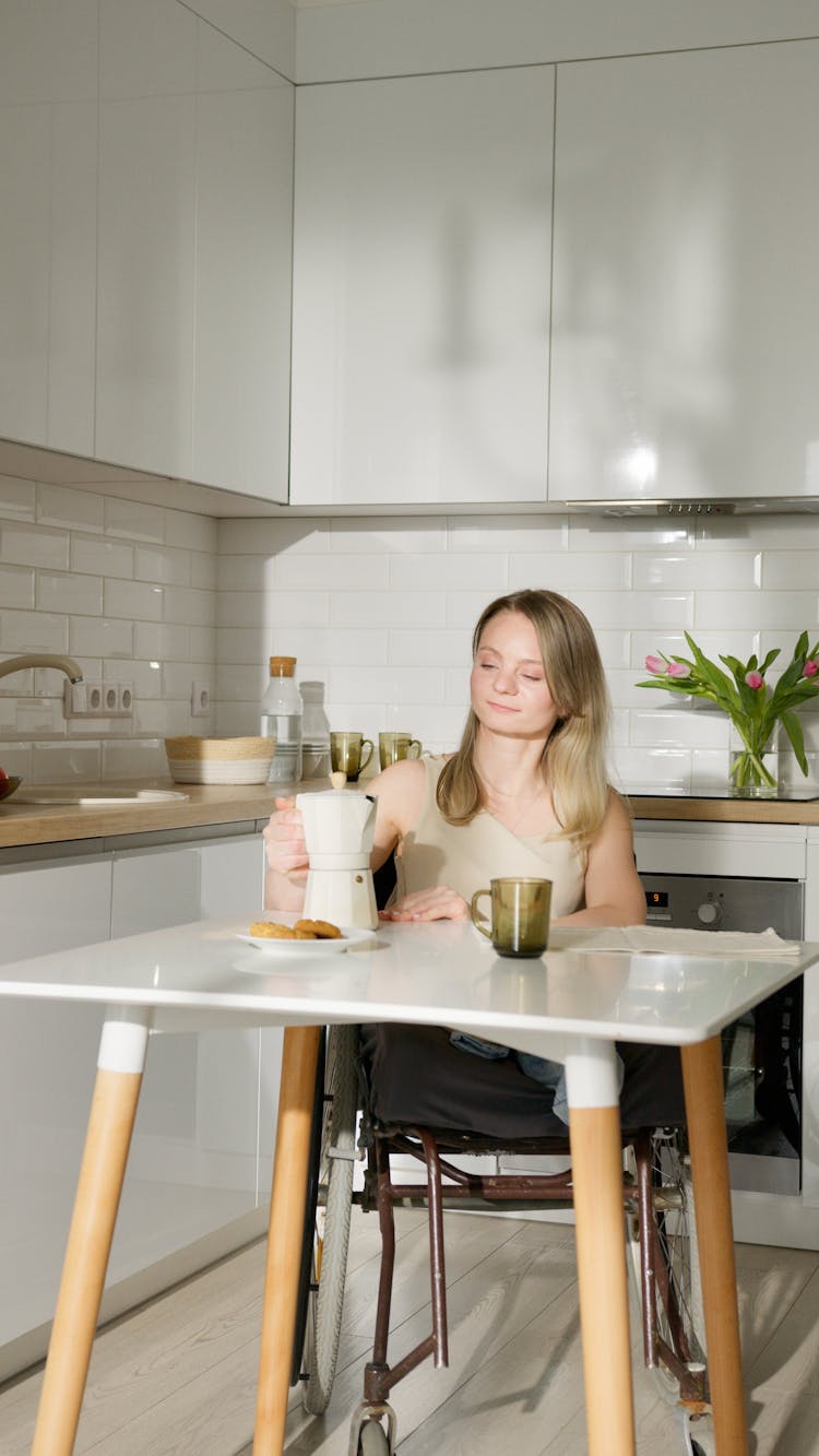 Woman In White Tank Top Sitting On Wheelchair