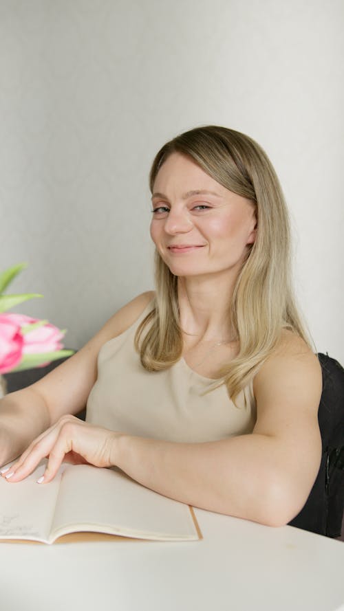 A Woman in Beige Tank Top Smiling