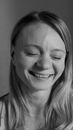 Grayscale Photo of Smiling Woman