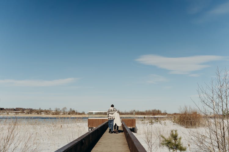 Couple Walking On The Boardwalk