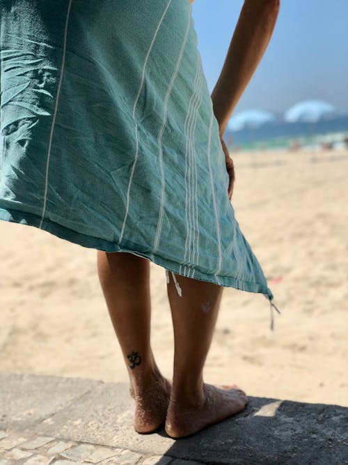 Woman in Green Dress Standing on the Concrete Floor