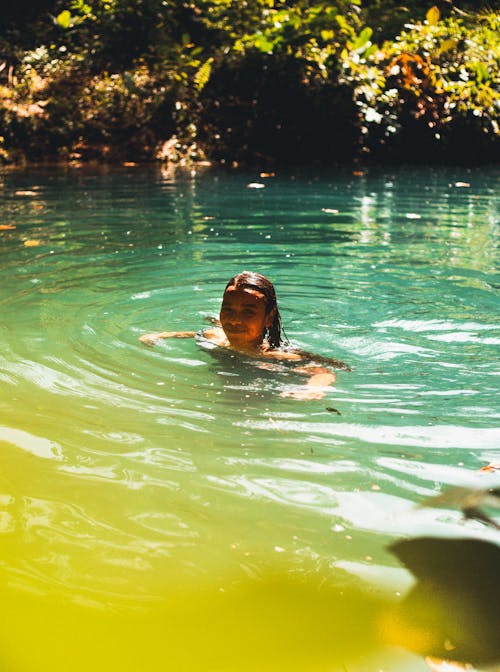 A Woman Swimming in the Lake 