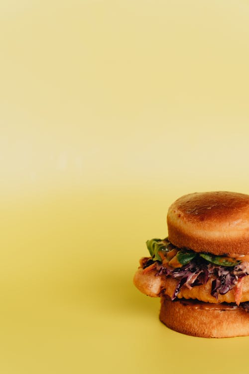 Free Burger Sandwich on Yellow Surface Stock Photo