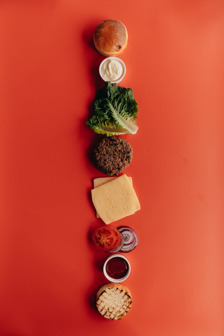 Deconstructed Burger On Red Surface