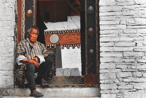 A Man Sitting at the Doorway