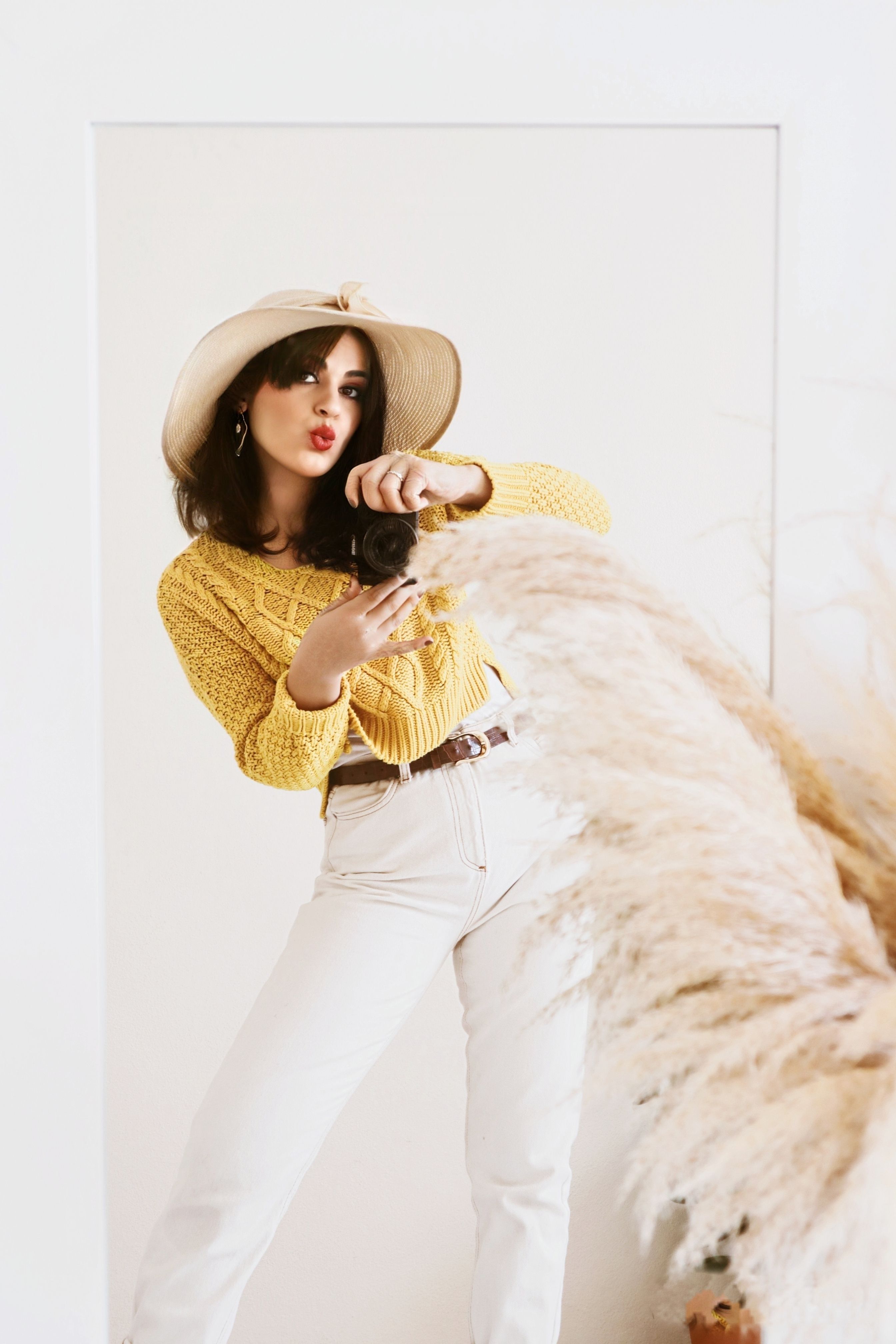 Woman in Yellow Sweater and White Pants Posing · Free Stock Photo