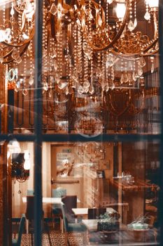 Luxurious interior featuring crystal chandeliers and chic decor, perfect for sophistication.