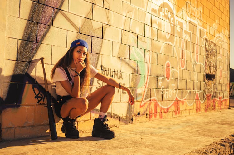 A Woman Leaning On The Wall