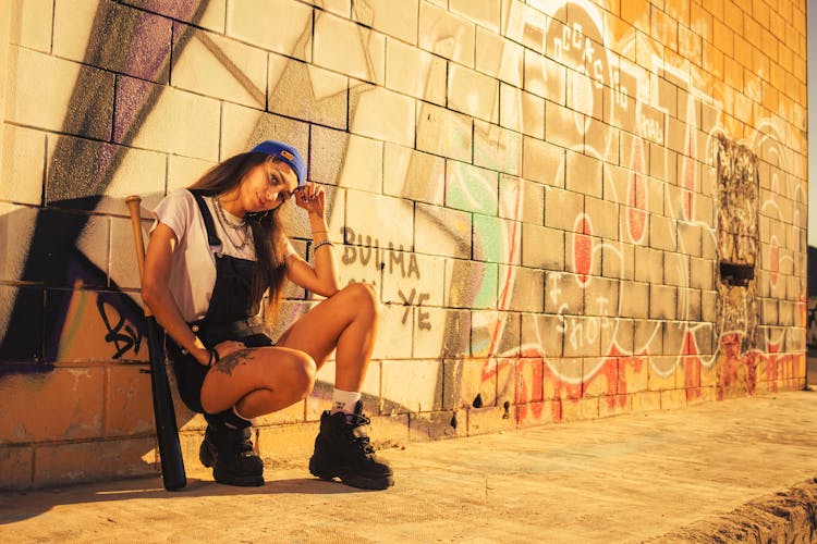 A Woman Leaning On The Wall