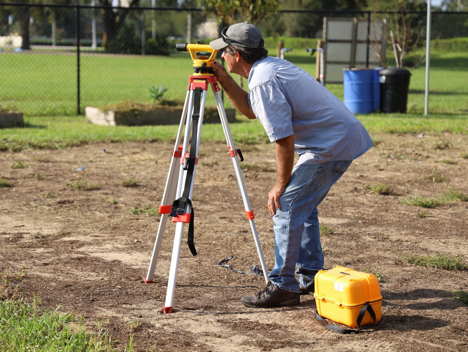 Professional land surveyor working in the field