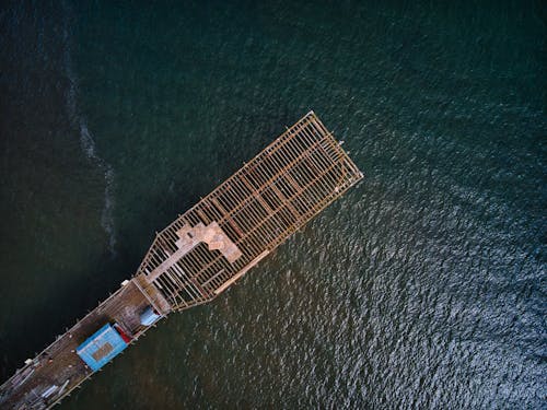 High Angle Photo of Wooden Watercraft on Sea