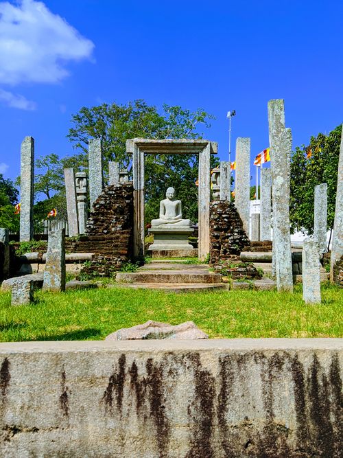 Free Explore the serenity of an ancient Buddha statue at a historic site in Anuradhapura. Perfect for cultural heritage enthusiasts. Stock Photo