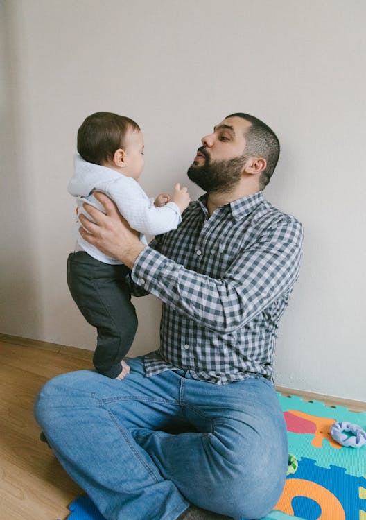 Free Father Looking at His Cute Baby Stock Photo