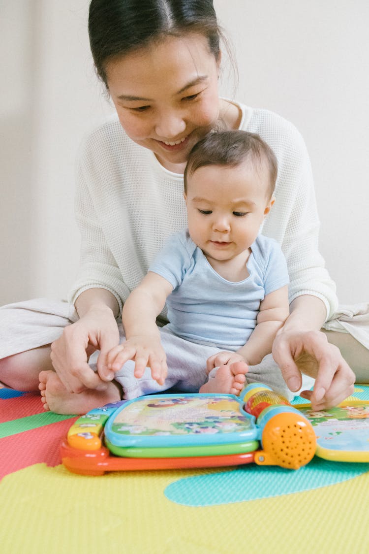 Mother And Baby Playing Together