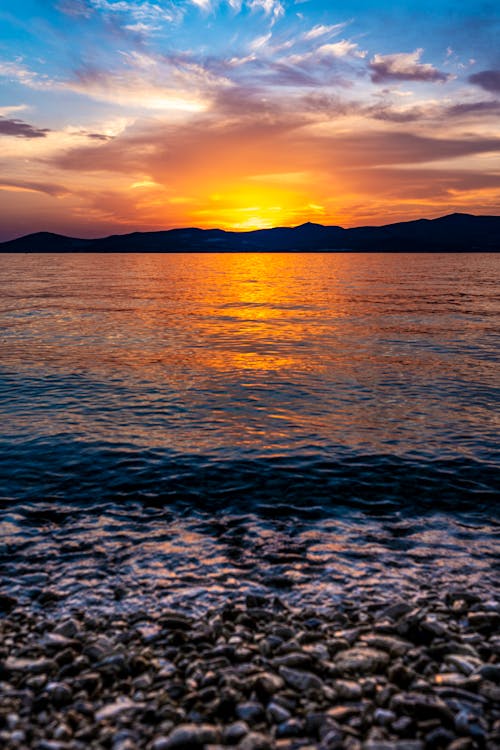 คลังภาพถ่ายฟรี ของ พระอาทิตย์ตกที่ชายหาด