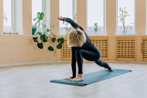 Flexible Person Doing a Yoga Pose Indoors