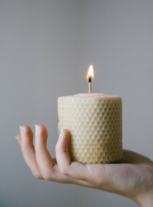 Free Person Holding A Lighted Candle Stock Photo