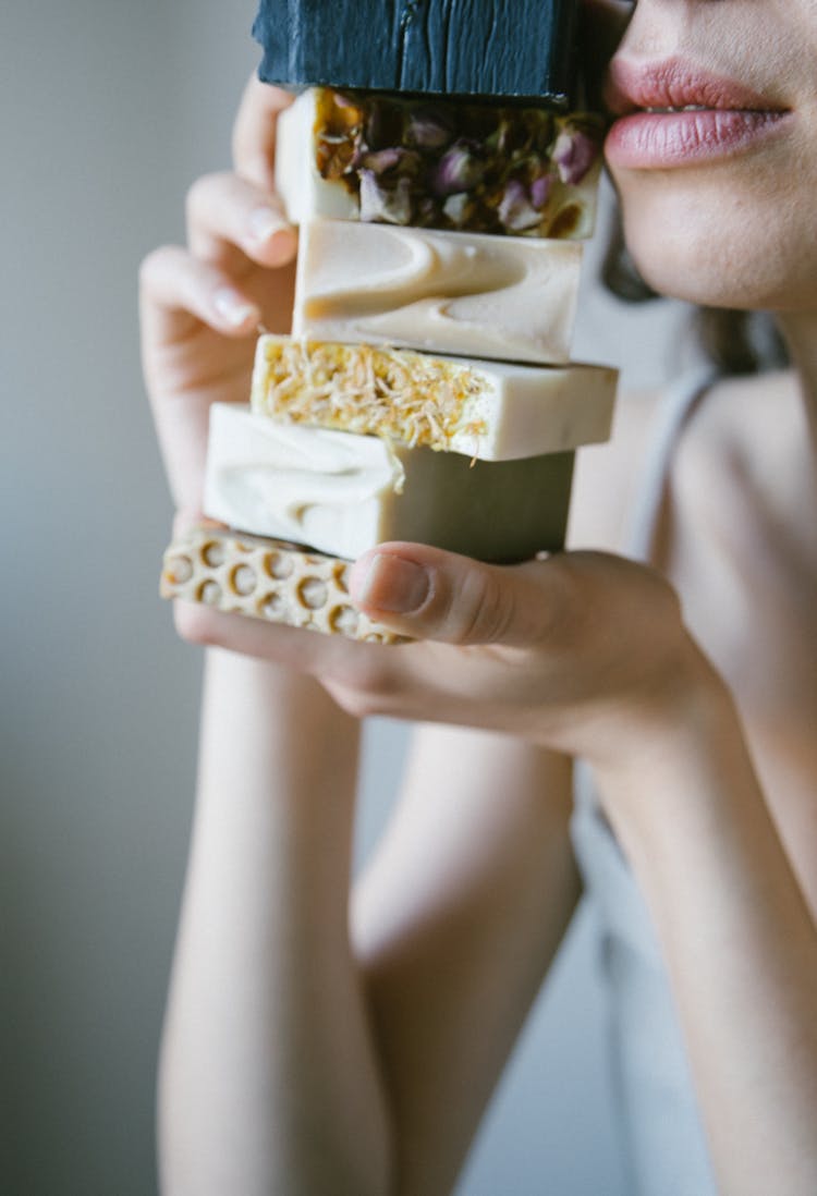 A Person Holding Soap Bars