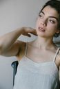 Woman in White Spaghetti Strap Top
