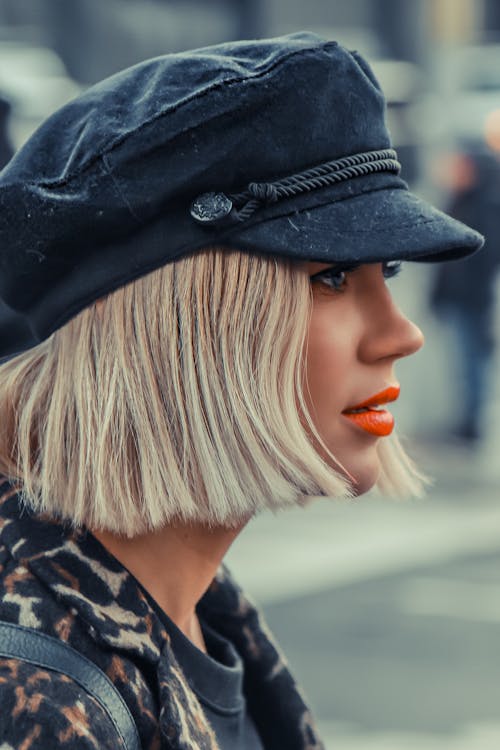 Portrait of a Woman with Short Blond Hair Wearing a Cap