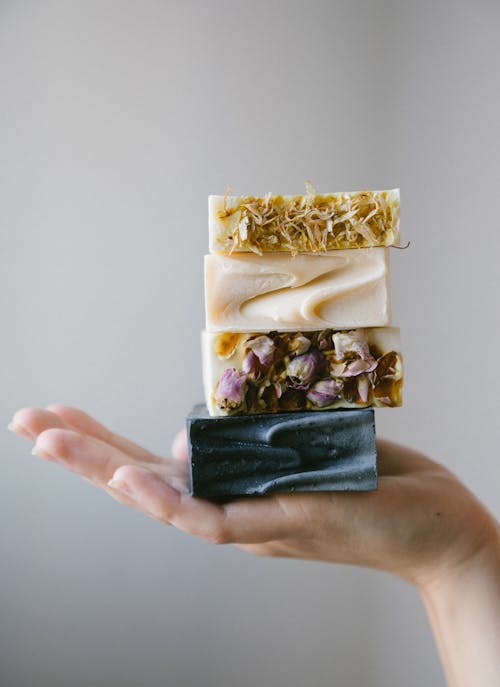 Free Person Holding Various Organic Bar Soaps Stock Photo