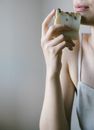 Woman in White Tank Top Holding Sliced Apple